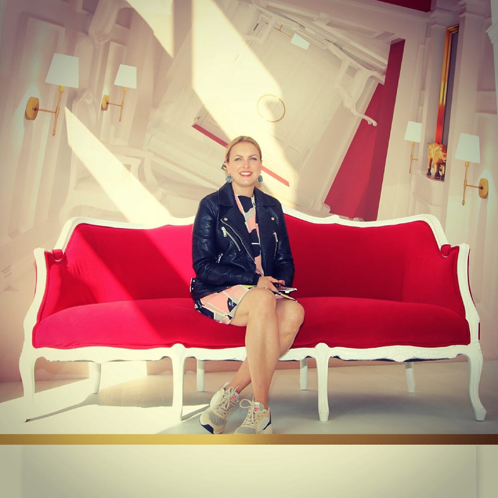 Sarah Manning sat on a sofa.