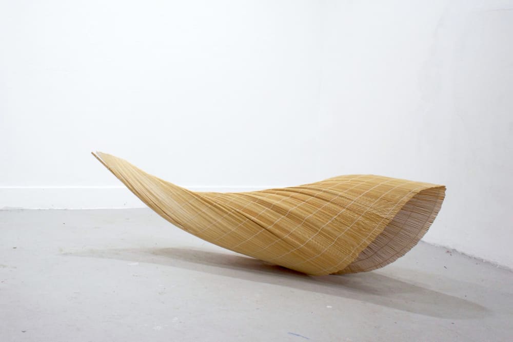 bamboo blinds constructed into a folded sculpture 