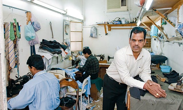 Tailors working in a sewing room