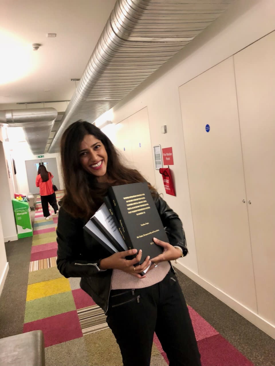 Karishma carrying books