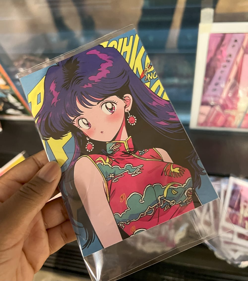 a postcard with an anime character on it