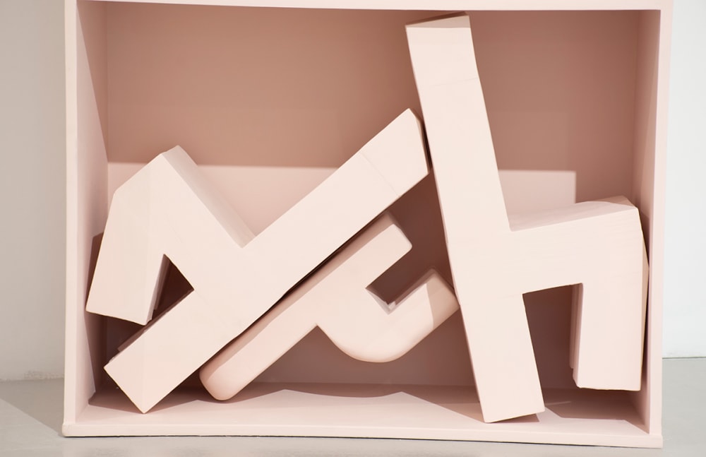 A sculpture of broken chairs.