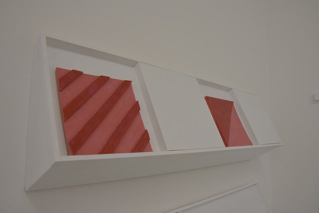 An installation view of two tactile blocks on the wall