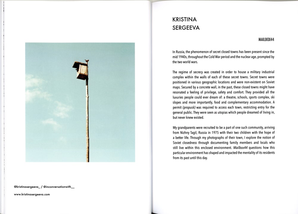 a photo of an open zine with text and an image of a bird house on a pole