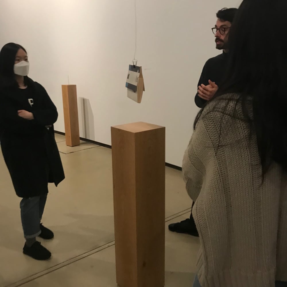 Students looking at a sculpture