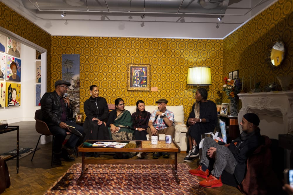 People sat on a sofa having a discussion