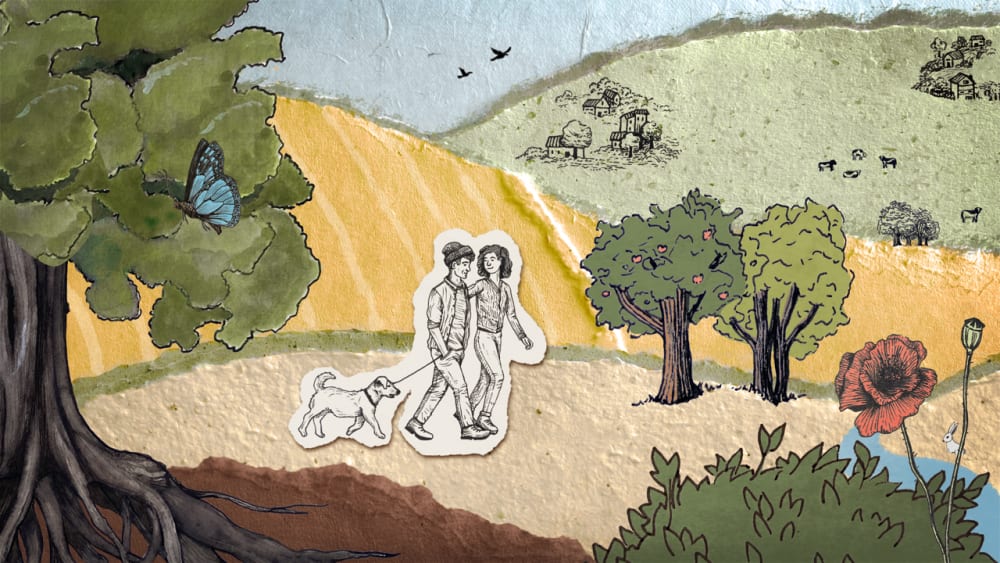 Paper collage creating a scene of hills and fields, with people walking in the forefront