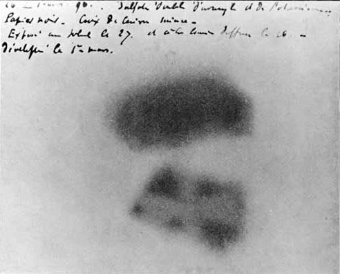 Image of Becquerel's photographic plate which has been fogged by exposure to radiation from a uranium salt. The shadow of a metal Maltese Cross placed between the plate and the uranium salt is clearly visible.