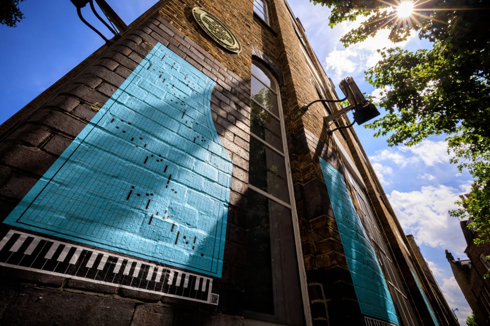 Woon Ko's graphic poster on the wall at Jerusalem Passage, Clerkenwell