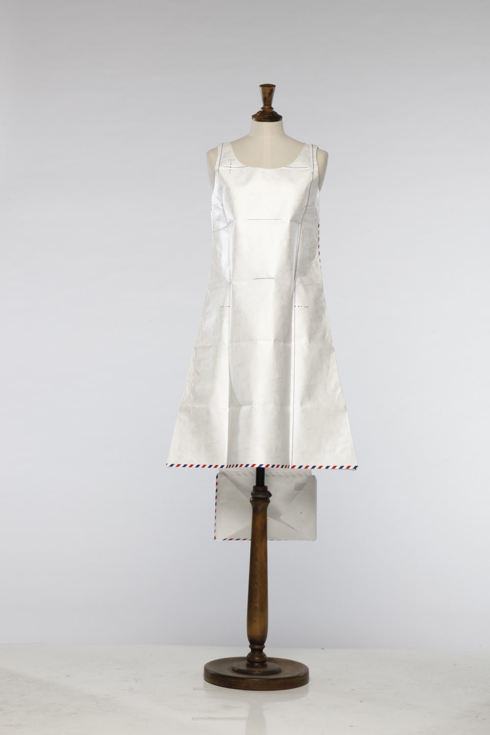 Dress made of white paper on mannequin