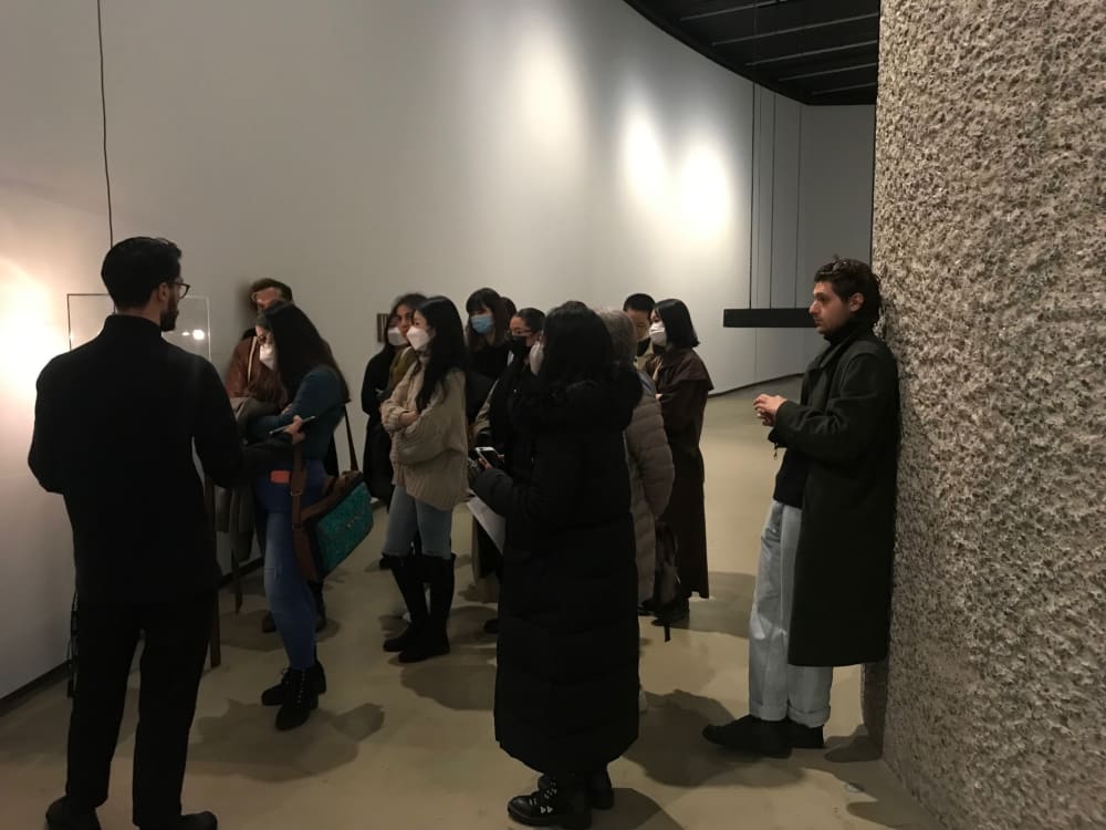 Students listening to a curator