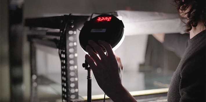 A student operating the lighting in the animation studio.