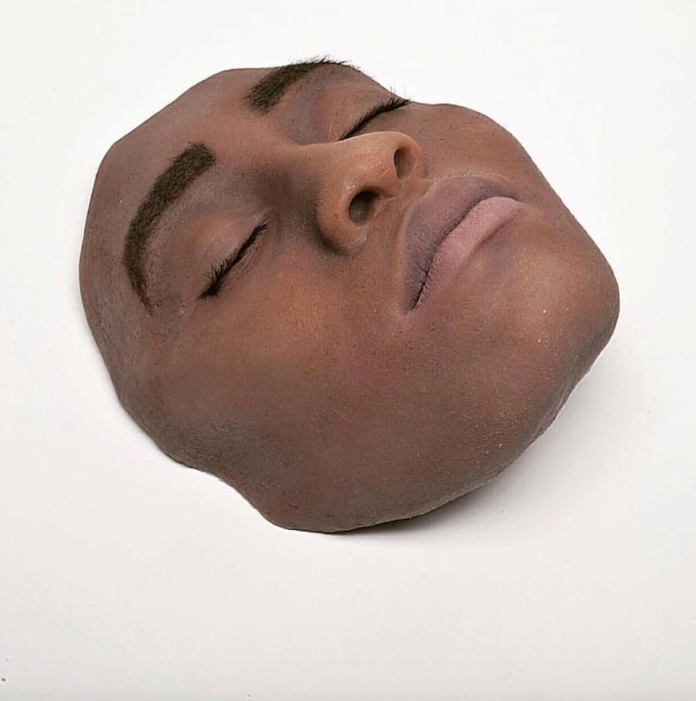 a realistic sculpture of a face
