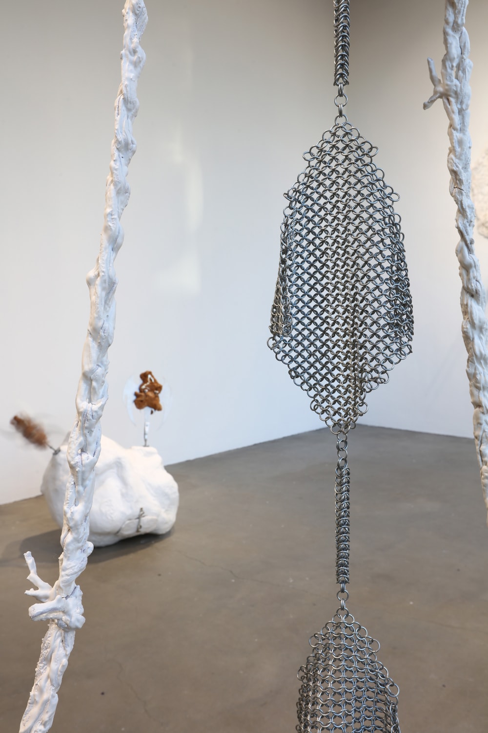 close up of Isobel's installations, created from plaster, synthetic fibres, hand woven steel