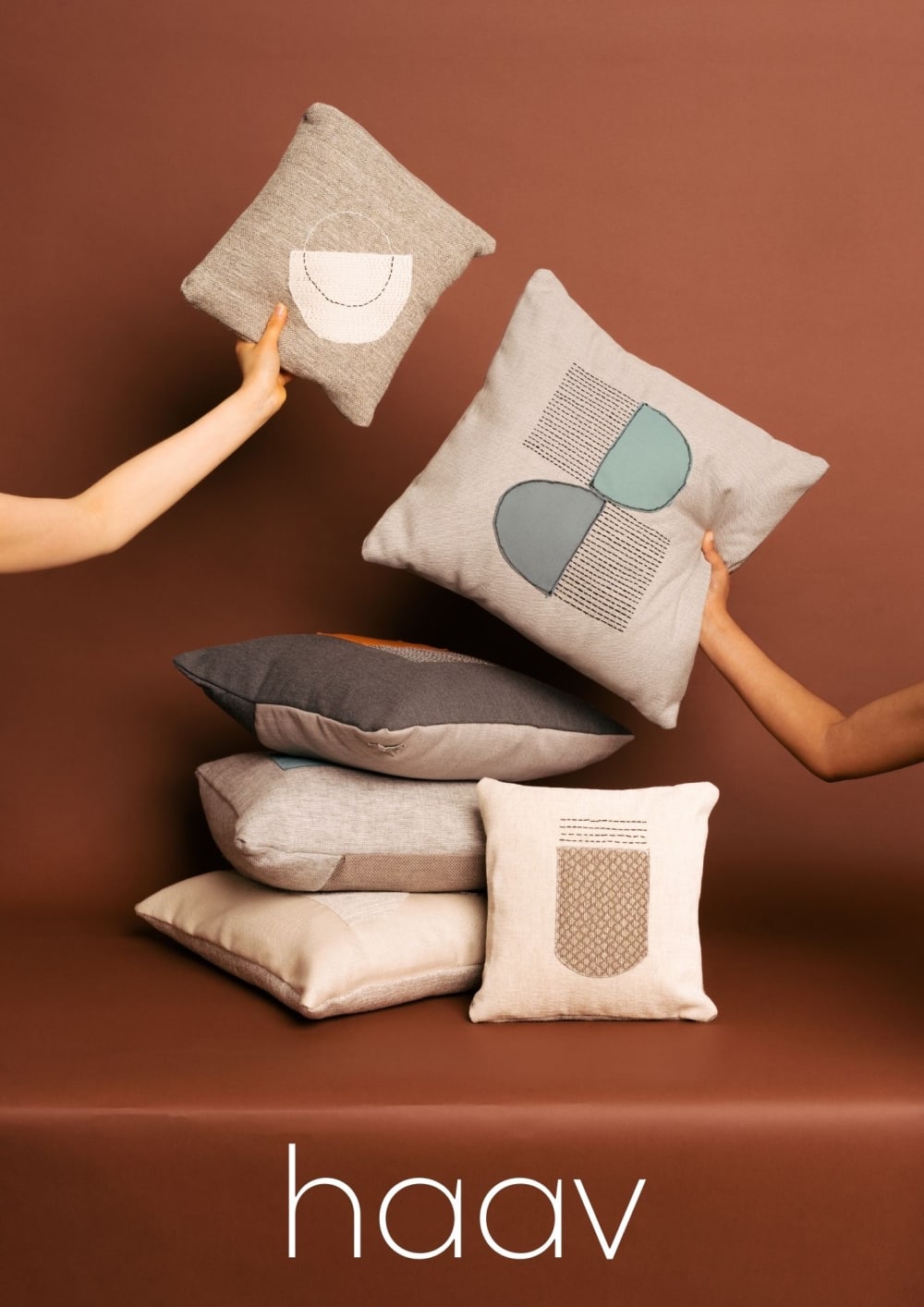 photo of arms holding pillows