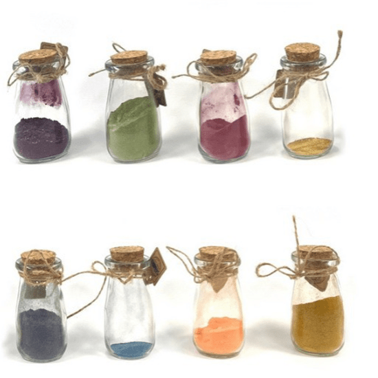 eight jars of different coloured natural dye powder