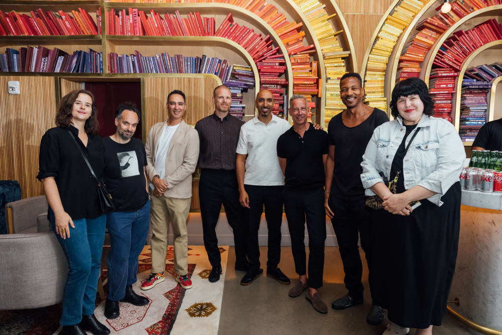 Volunteers and speakers standing together