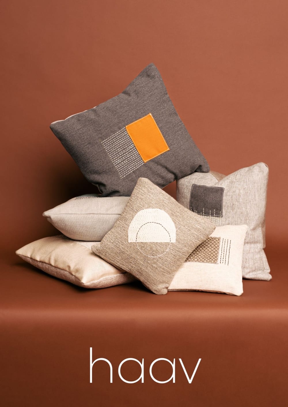 photo of a group of earthtone pillows in an arrangement