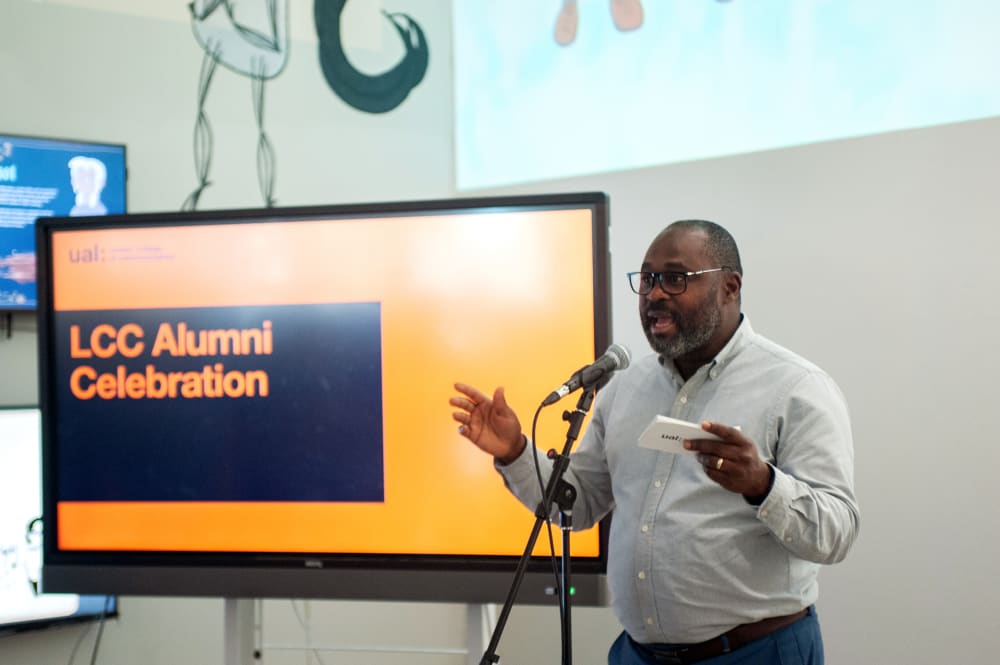 Kene welcoming guests to the exhibition