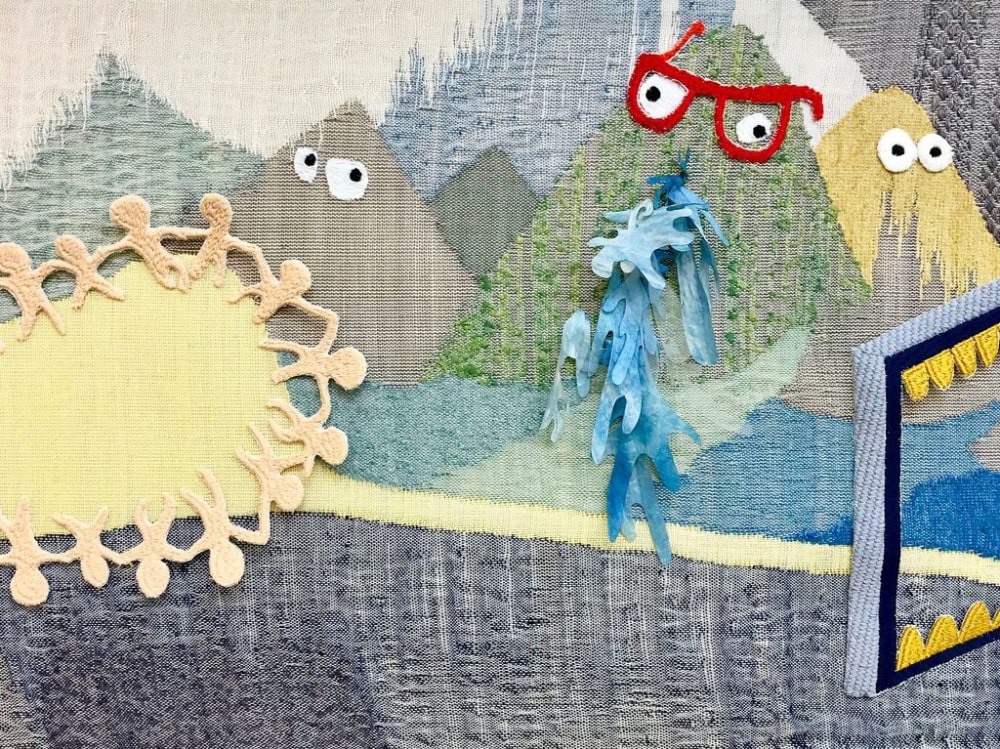 Colourful weaving of mountains with faces.