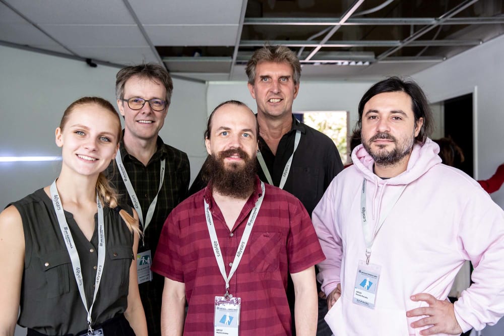 A group of people looking at the camera.