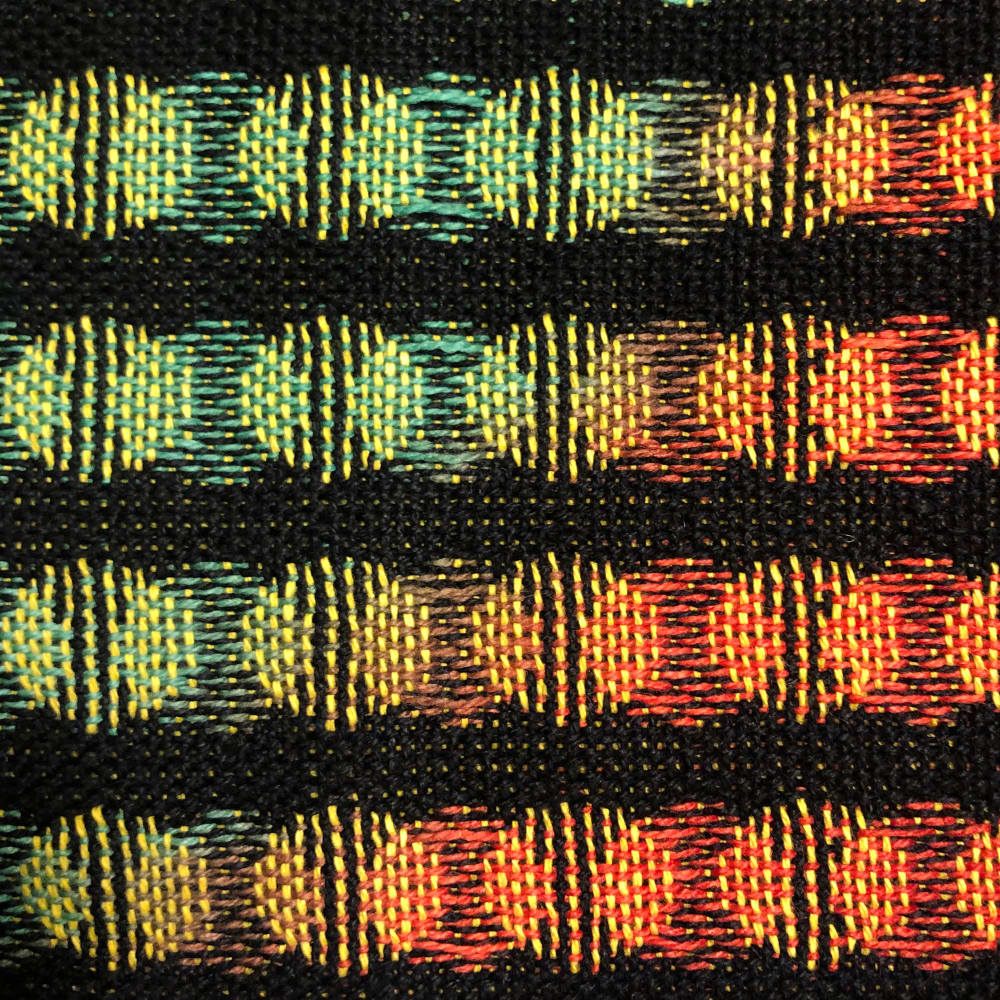 Woven textile with colourful overlapping dots
