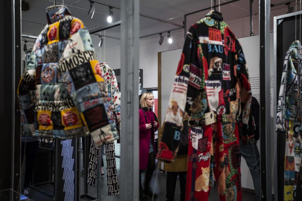 two patchwork jackets displayed in a shop window