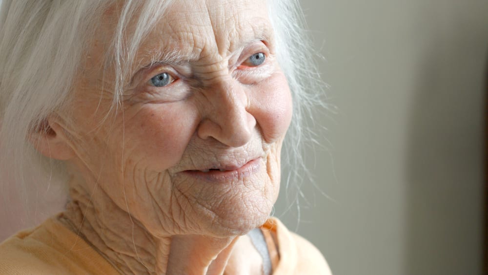 Still from the film. A close-up of an elderly woman's face.