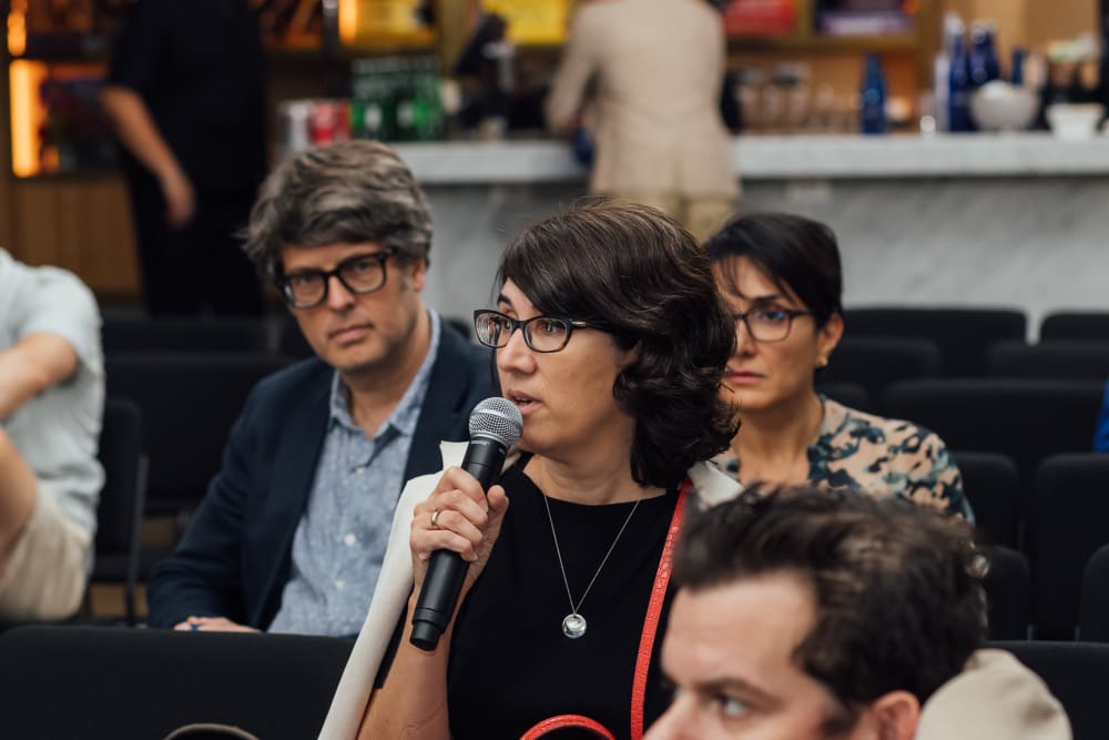 Guest asking a question at the event