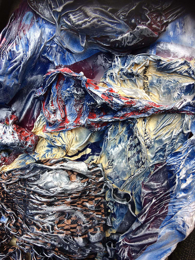A close-up of Plastico’s cape, made of old plastic bags and containers, and EVA foam covered with thermoplastic and paint