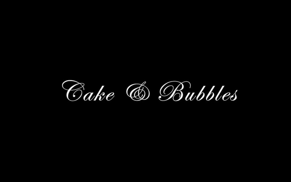 A black and white graphic which reads: 'Cake and Bubbles'.