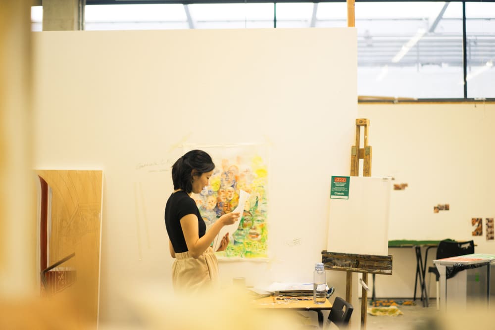 the artist in a painting studio