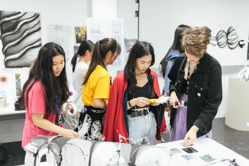 a group of students working on a creative project
