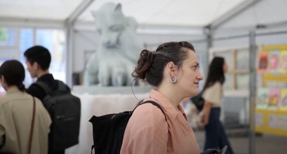 A woman looking at work in a gallery