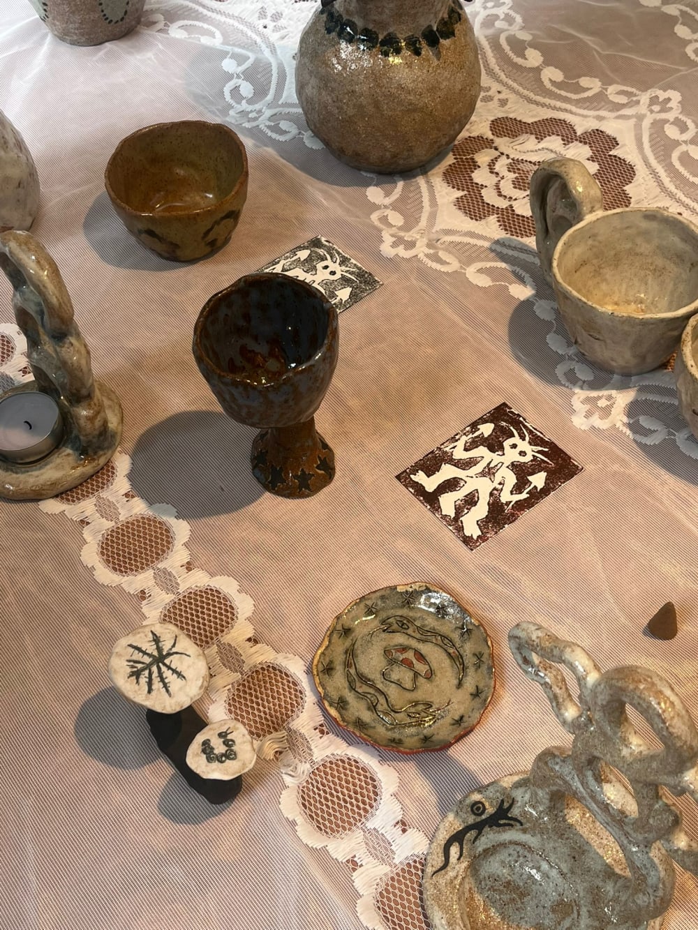 Stallholder showcasing artworks