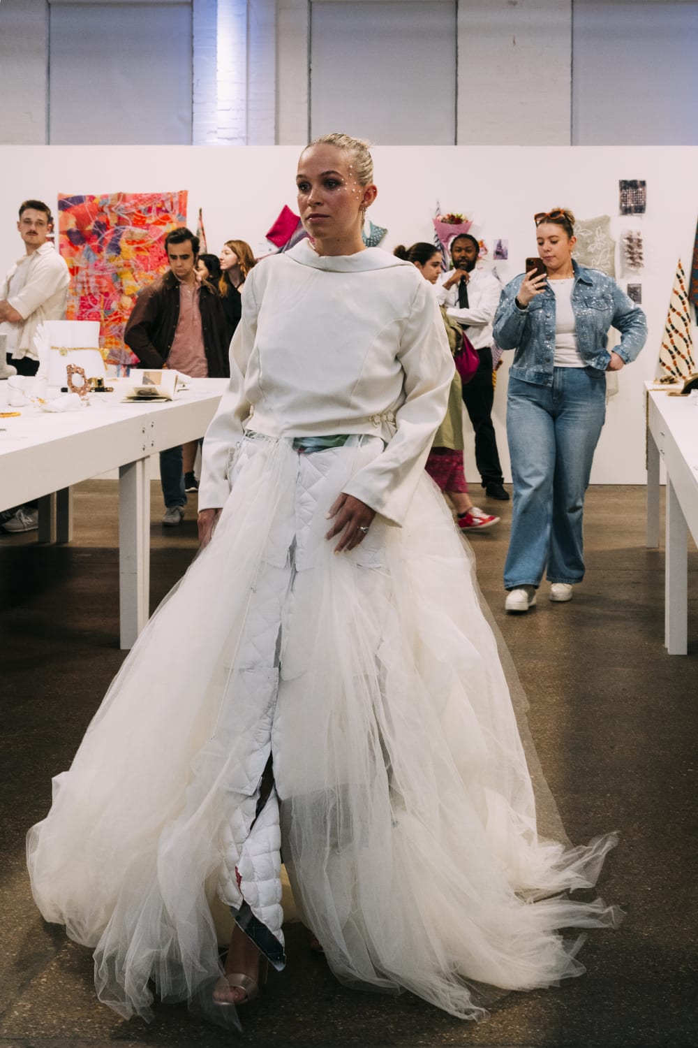 Woman wearing all white with netted skirt costume