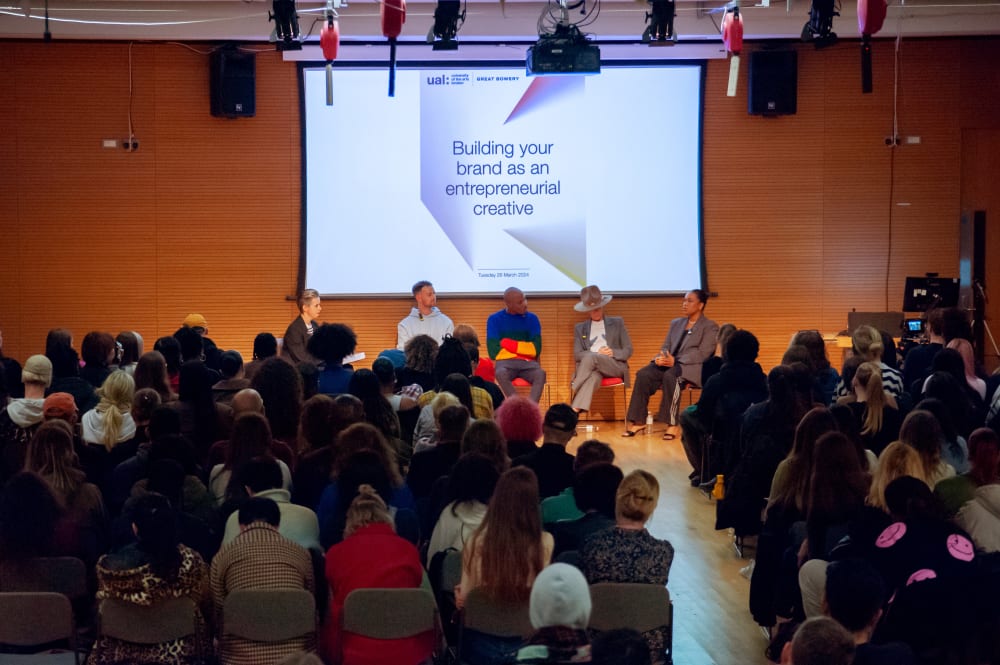 Crowd of guests seated in front of the panellists
