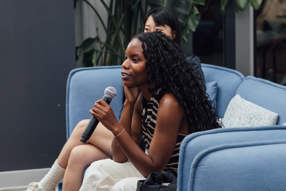 Guest asking a question at the event