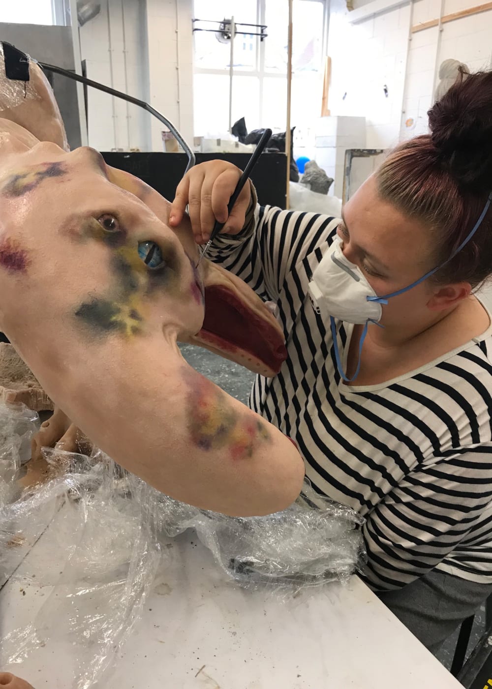 Jessica Merritt finishing and painting model