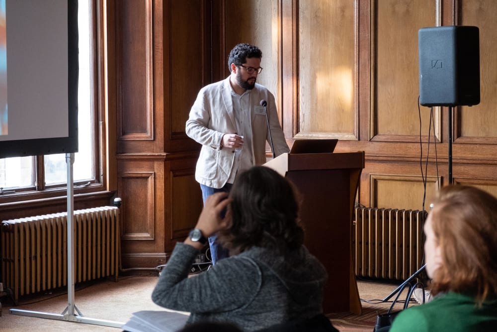 Jose-Eliel presenting at the lectern.