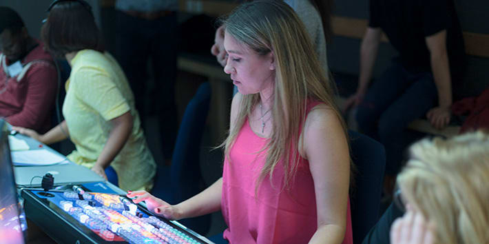 A student operating the Tricaster 8000 system.