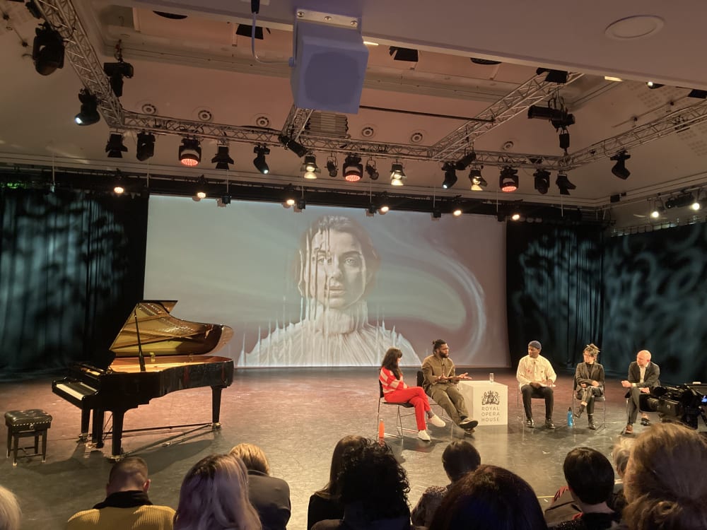 Event panelists on stage