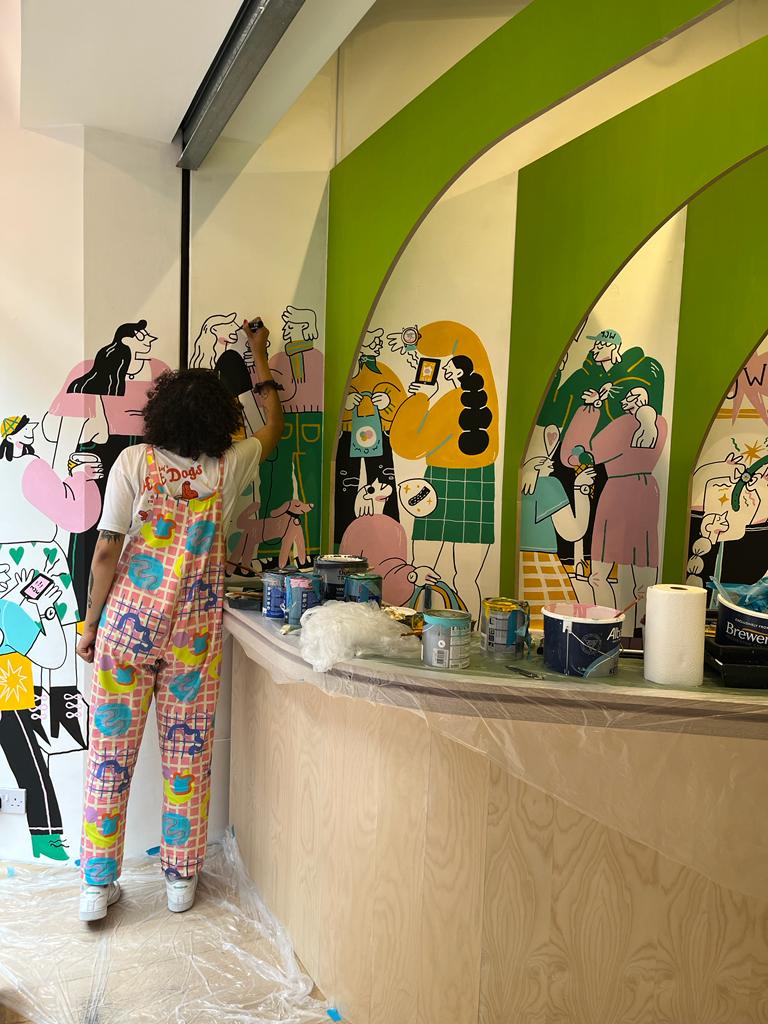 Catarina Morais painting a mural for Mr Jones Watches