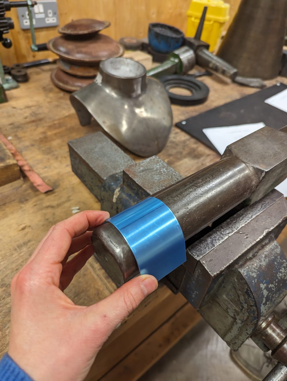 Iona bending silver into a D shape