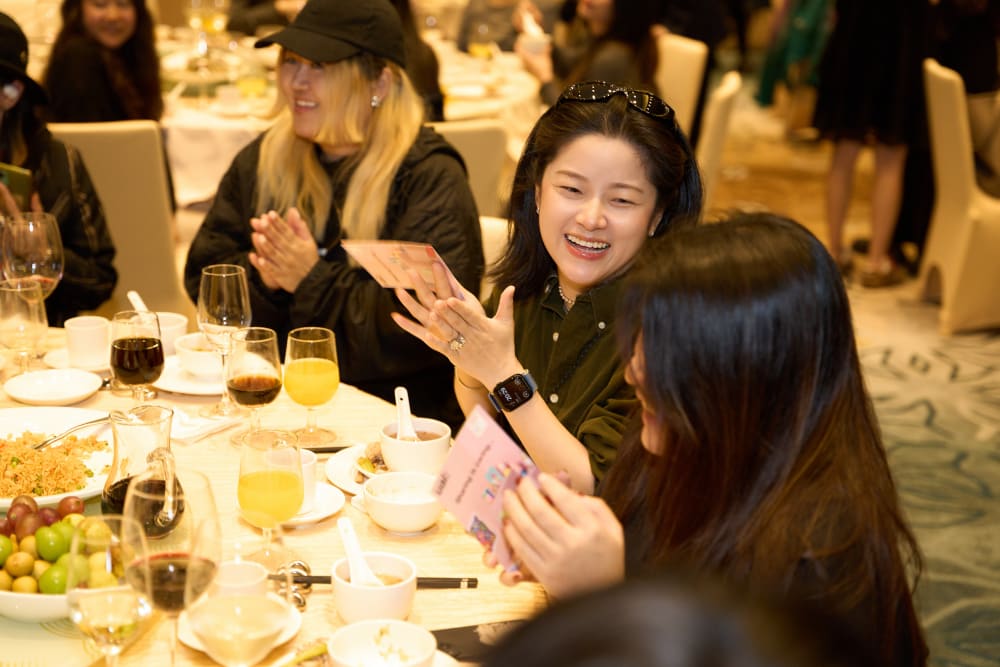 Guests clapping and smiling at each other