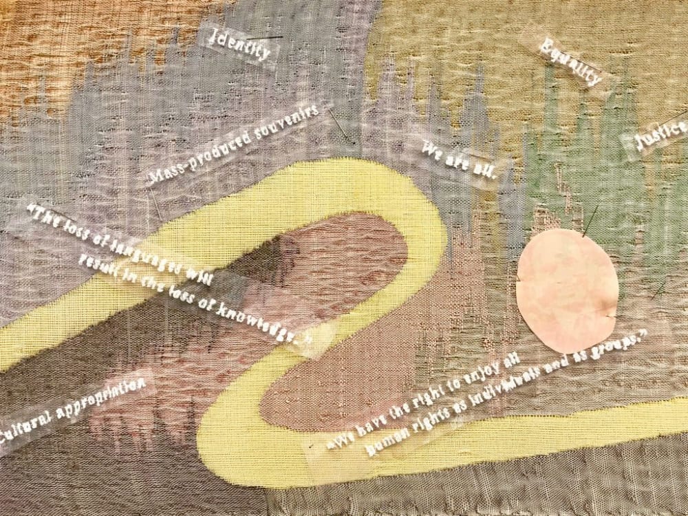 A detail of a colourful patch of weaving.