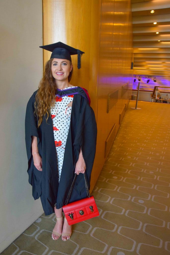 A female student in a graduation gown