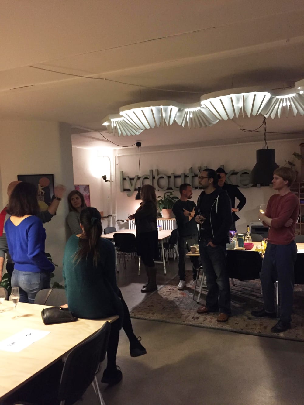 A group of people chatting in a room