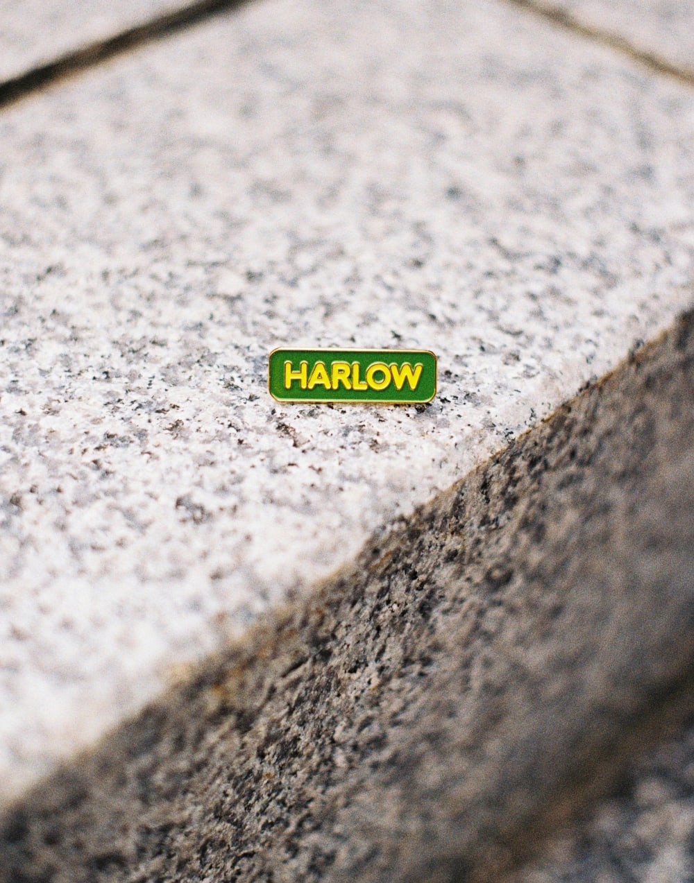a pin sits on a concrete step