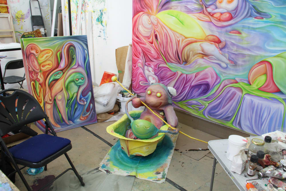 Studio with some of Xiuching's work in the background